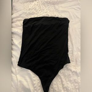 Black strapless bodysuit.